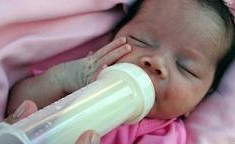 An infant drinking milk